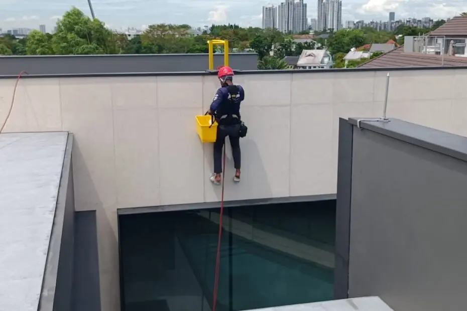 man cleaning the wall