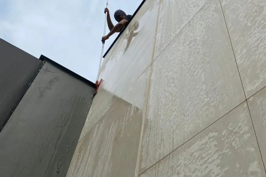 man cleaning a wal